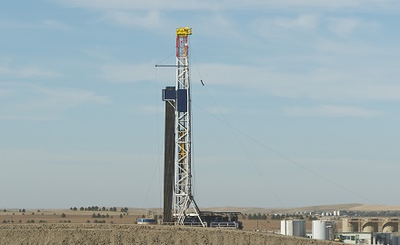Drilling performance of non-aqueous fluids is improved in challenging shale